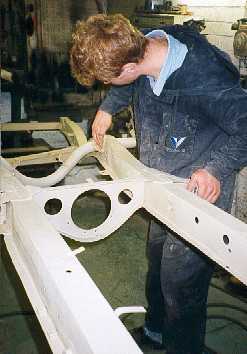 Rubbing down the chassis.