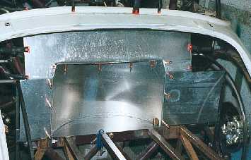 Rear boot bulkhead with spare wheel space.