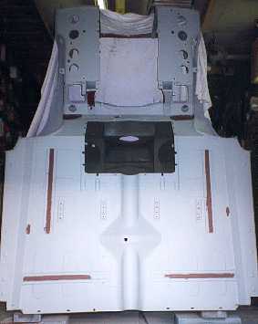 Underneath the cab.