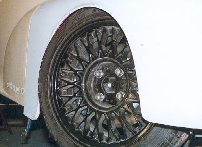 The Front Wheel In The Arch At Full Bump.