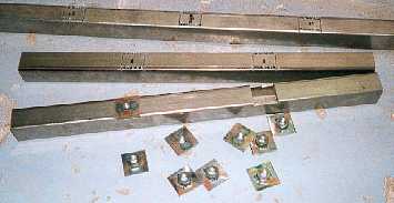 Captives in petrol tank mounting.