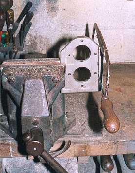 Hacksawing off the surplus metal.