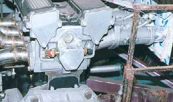 Adapter on the back of the cylinder head for water temperature sensors and heater outlet.