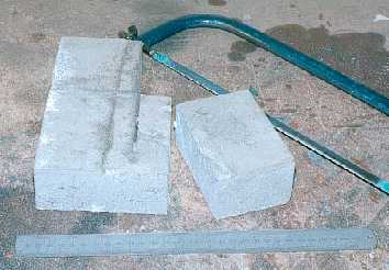 Cutting a big block of aluminium by hand.
