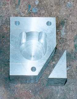 Cutting the corner off the block and holes drilled.