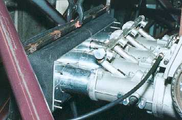 Flexible bellows and the mounting plate to the throttle bodies.
