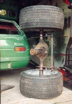 Rear axle, wheels and tyres stood up behind the car