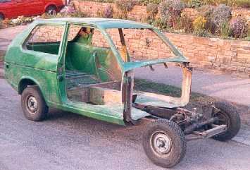 Car with front body work cut off.