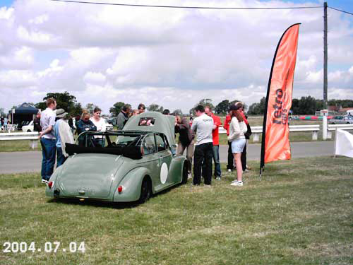 A Crowd Around The Car